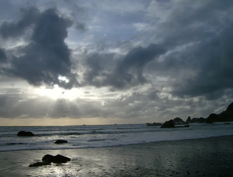 Choppy winter surf beneath dark clouds on the Brookings coast
