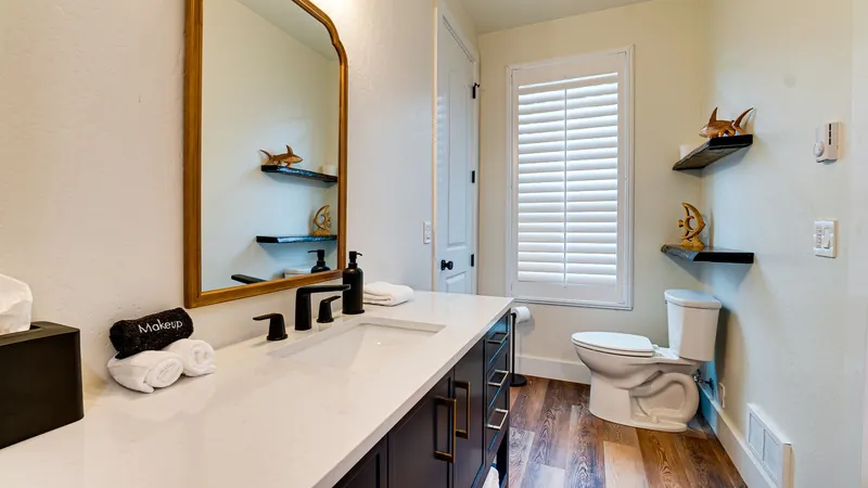 The Lily Pond House, Full bathroom with shower/bathtub.  Accessible from hallway and 2nd bedroom.